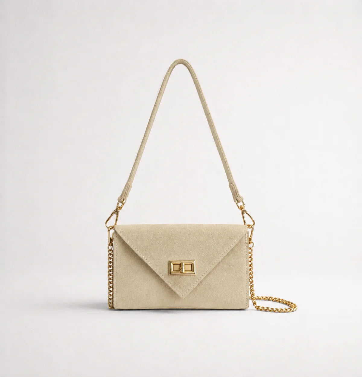 Italian handmade suede occasion bag in cream with gold chain strap, front view showing envelope silhouette and turn-lock clasp