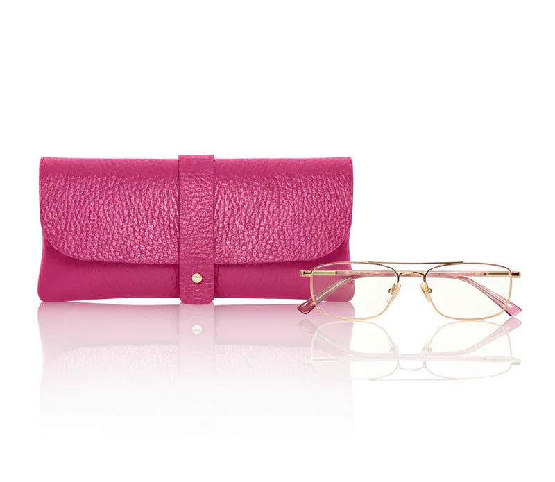 Fuchsia Italian genuine leather glasses pouch with gold-tone tab closure displayed alongside a pair of glasses, handmade in Italy | MERLEORA