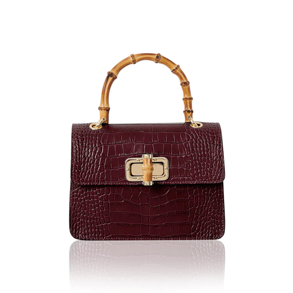 Italian croc-embossed leather bag with curved bamboo handle in burgundy with gold turn-lock clasp