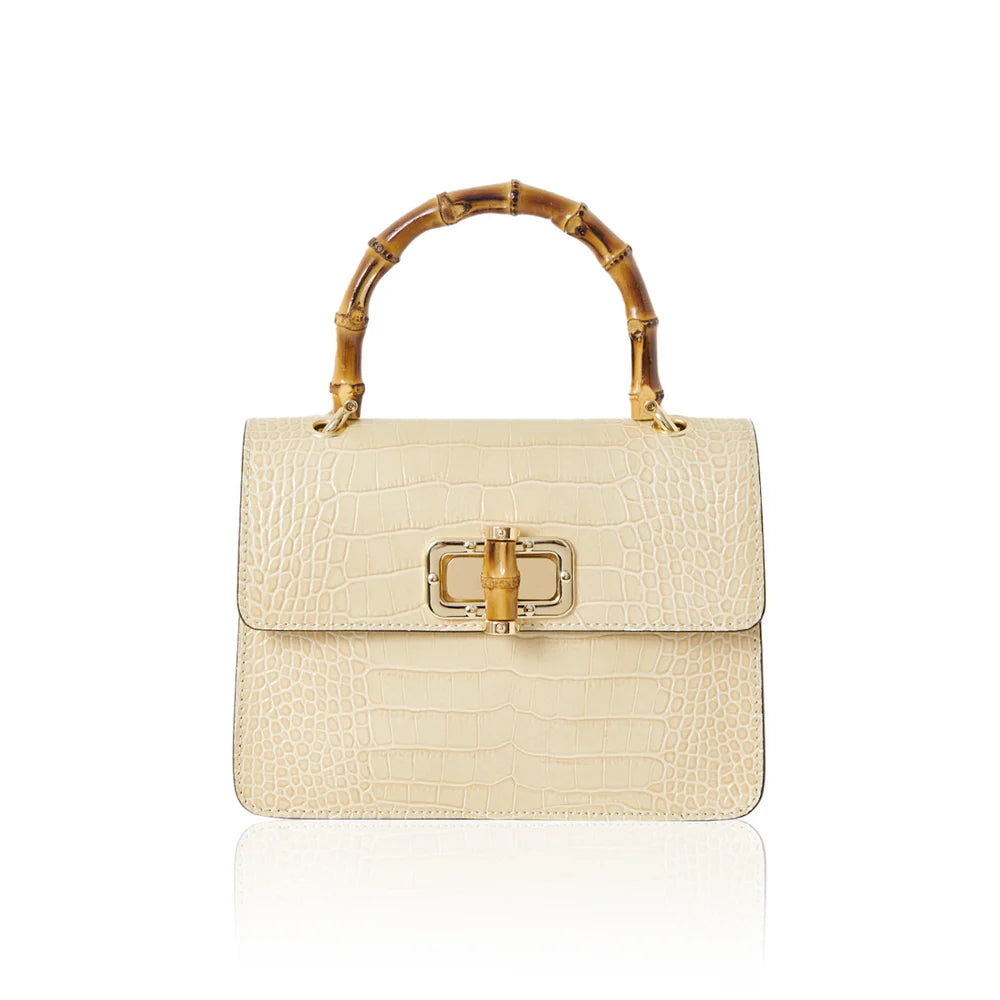 Italian croc-embossed leather bag with curved bamboo handle in cream with gold turn-lock clasp