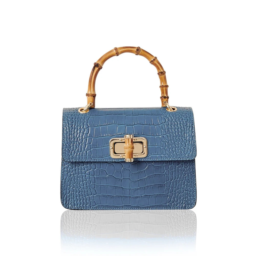 Italian croc-embossed leather bag with curved bamboo handle in denim blue with gold turn-lock clasp