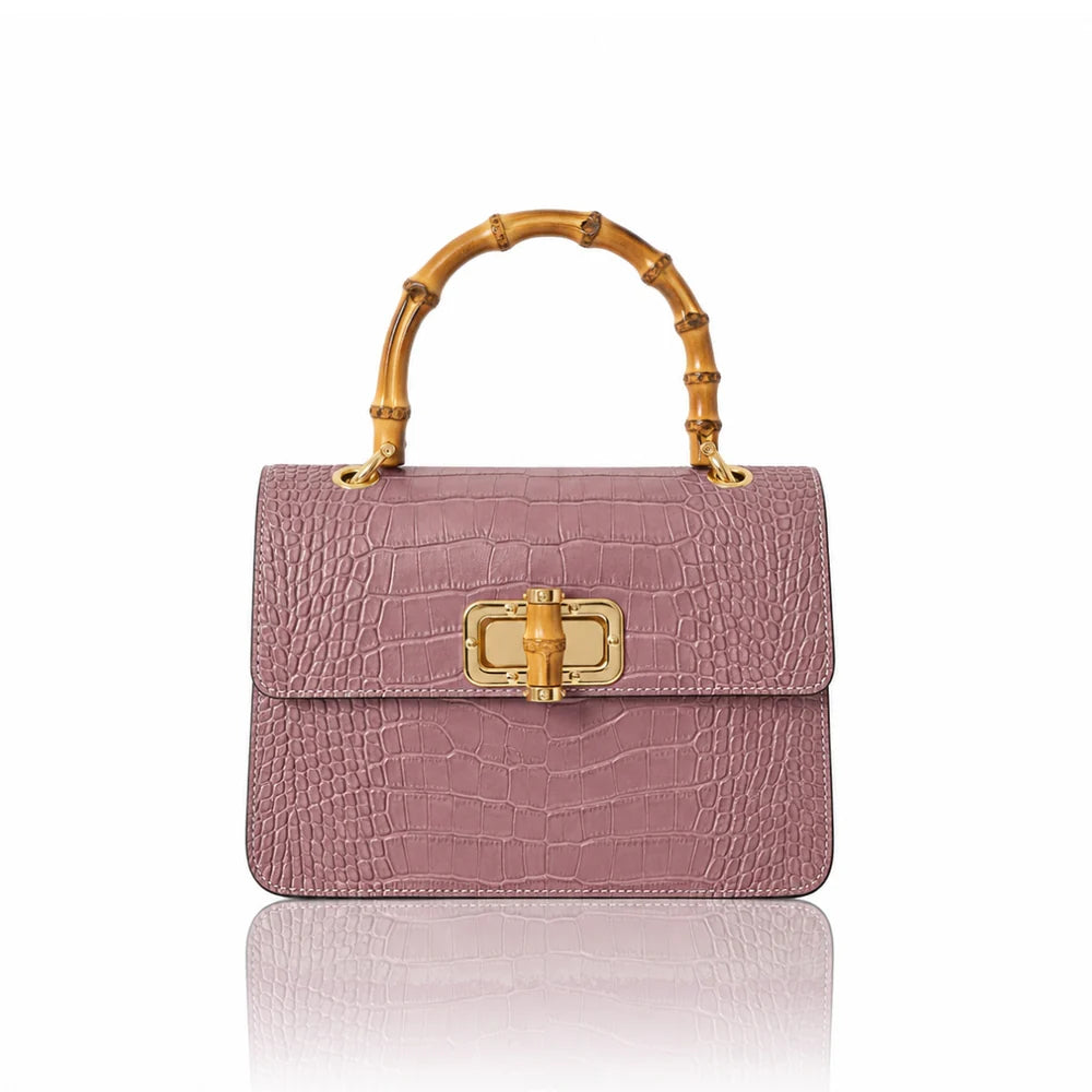 Italian croc-embossed leather bag with curved bamboo handle in dusty pink with gold turn-lock clasp