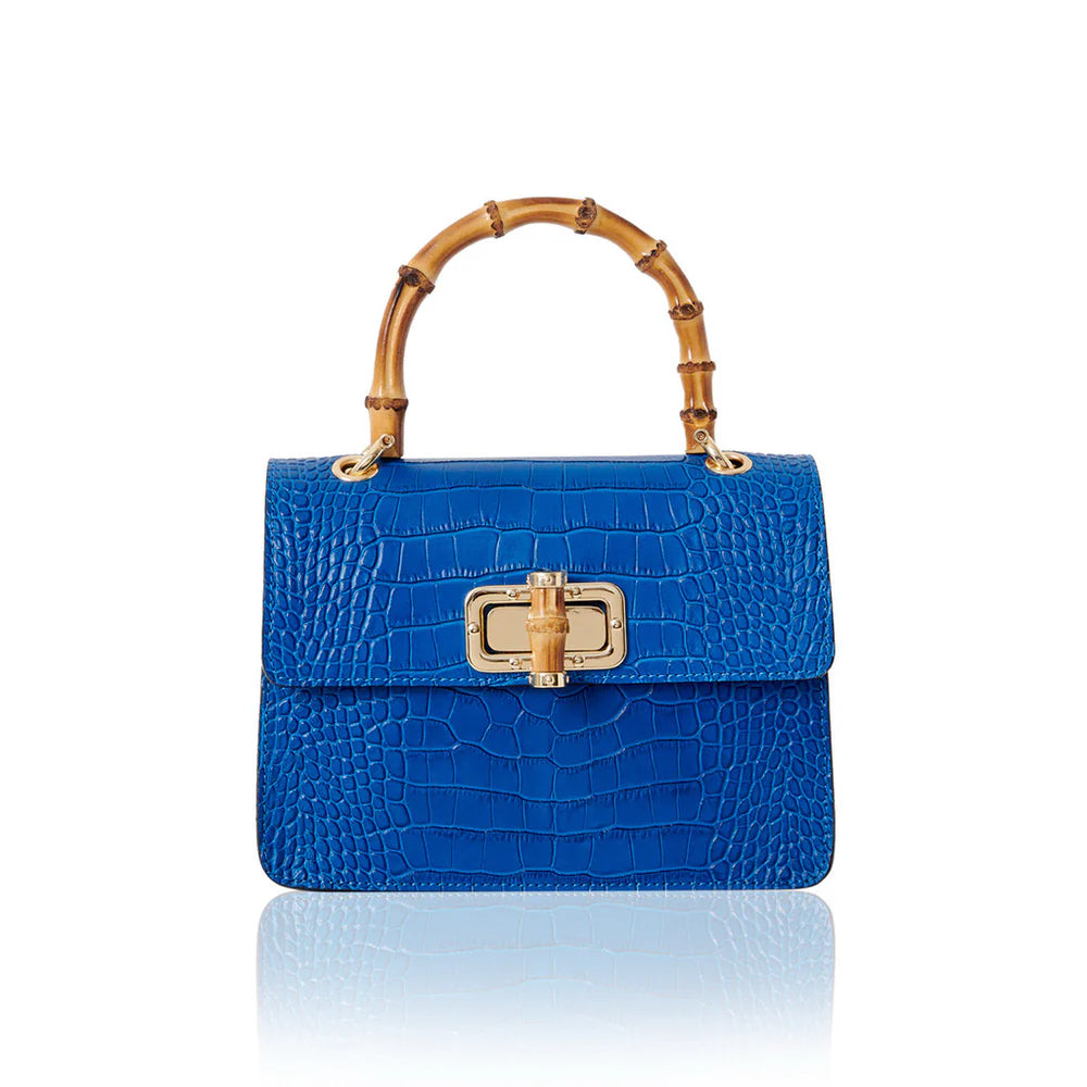 Italian croc-embossed leather bag with curved bamboo handle in royal blue with gold turn-lock clasp