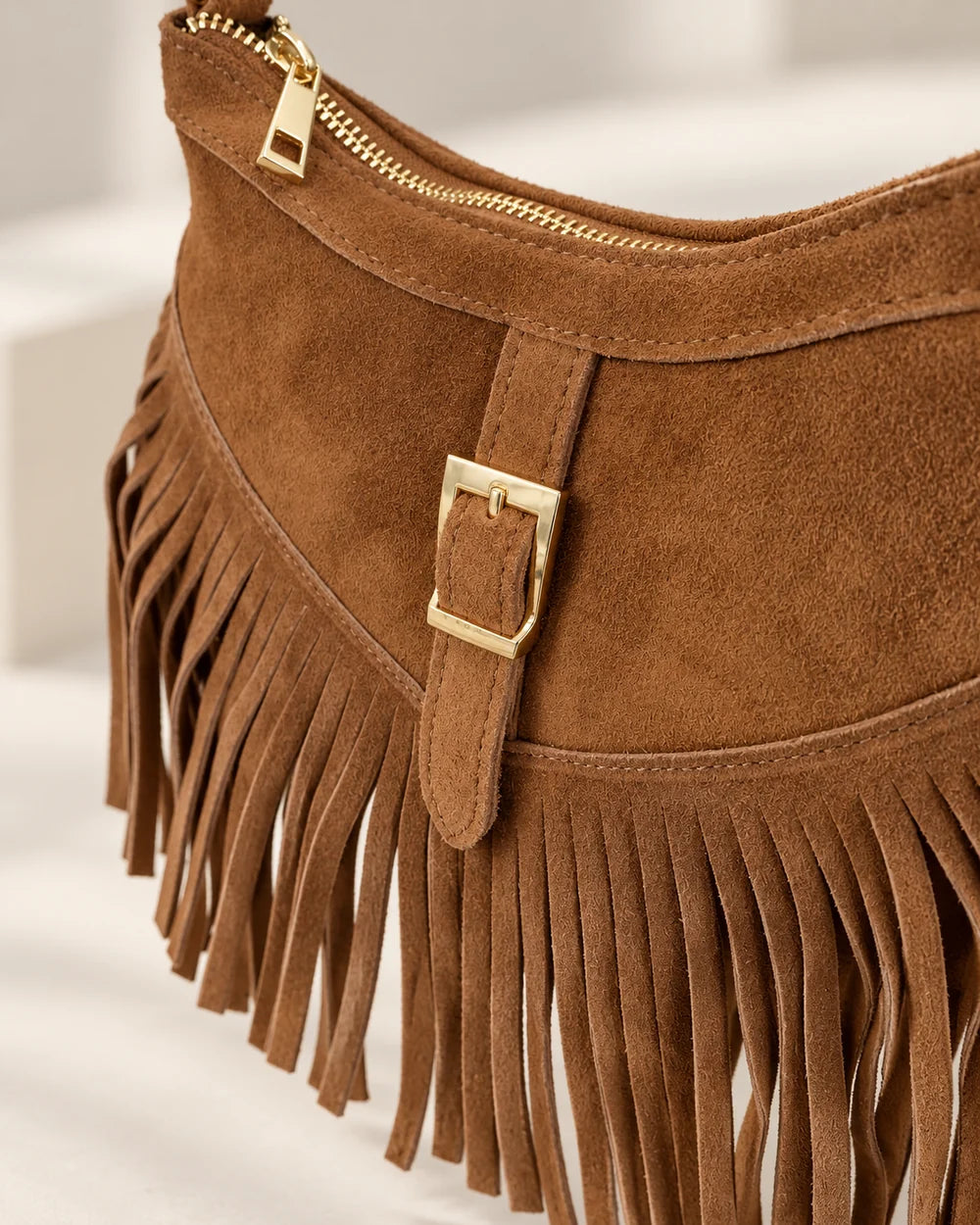 Italian Suede Fringe Shoulder & Crossbody Bag, close-up of suede texture, fringe, gold-tone buckle and zip | MERLEORA