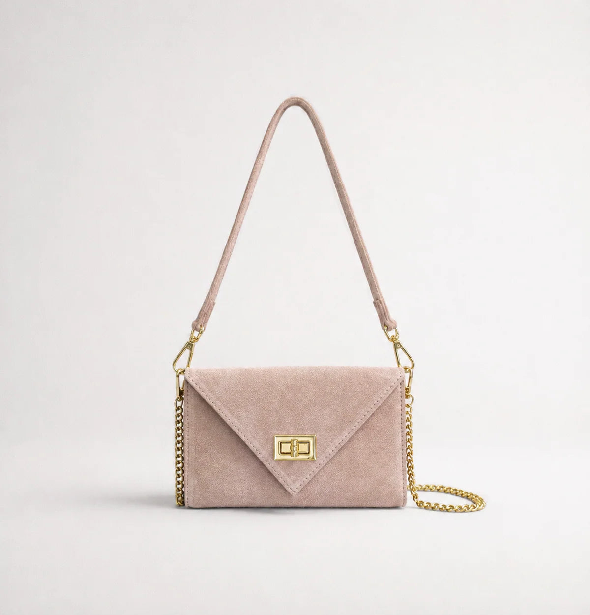Blush pink: Italian handmade suede occasion bag in blush pink with gold chain strap and turn-lock clasp