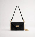Black: Italian handmade suede occasion bag in black with gold chain strap and turn-lock clasp