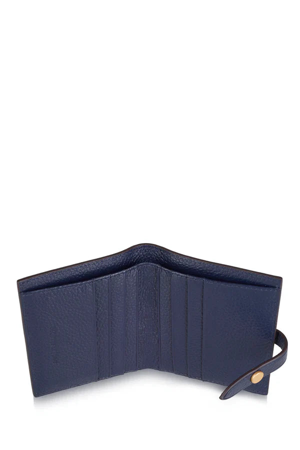 Interior open shot 1: Italian leather compact bi-fold wallet open showing navy leather interior with multiple card slots | MERLEORA
