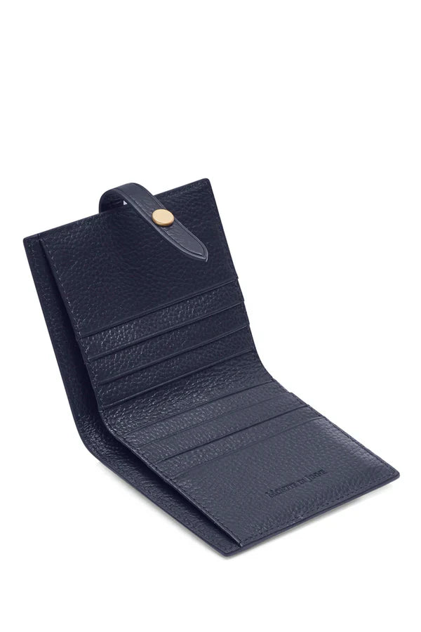 Interior open shot 2: Italian leather compact bi-fold wallet open flat showing navy leather interior with card slots and contrasting tab closure | MERLEORA
